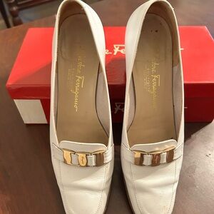 White Ferragamo loafers.